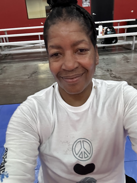 Las Vegas libero Ari wearing her Peace Love Volleyball shirt at practice. The "Peace Love Volleyball" shirts feature strategically placed quotes and symbols that serve as constant motivational reminders of a player's potential and goals.